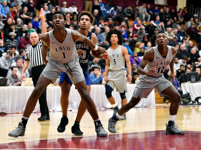 La Lumiere School's player Jaren Jackson Jr. (1), Tyger Campbell (5) and Isaiah Coleman Lands (11) battles for rebounding position against Sierra Canyon in 201
